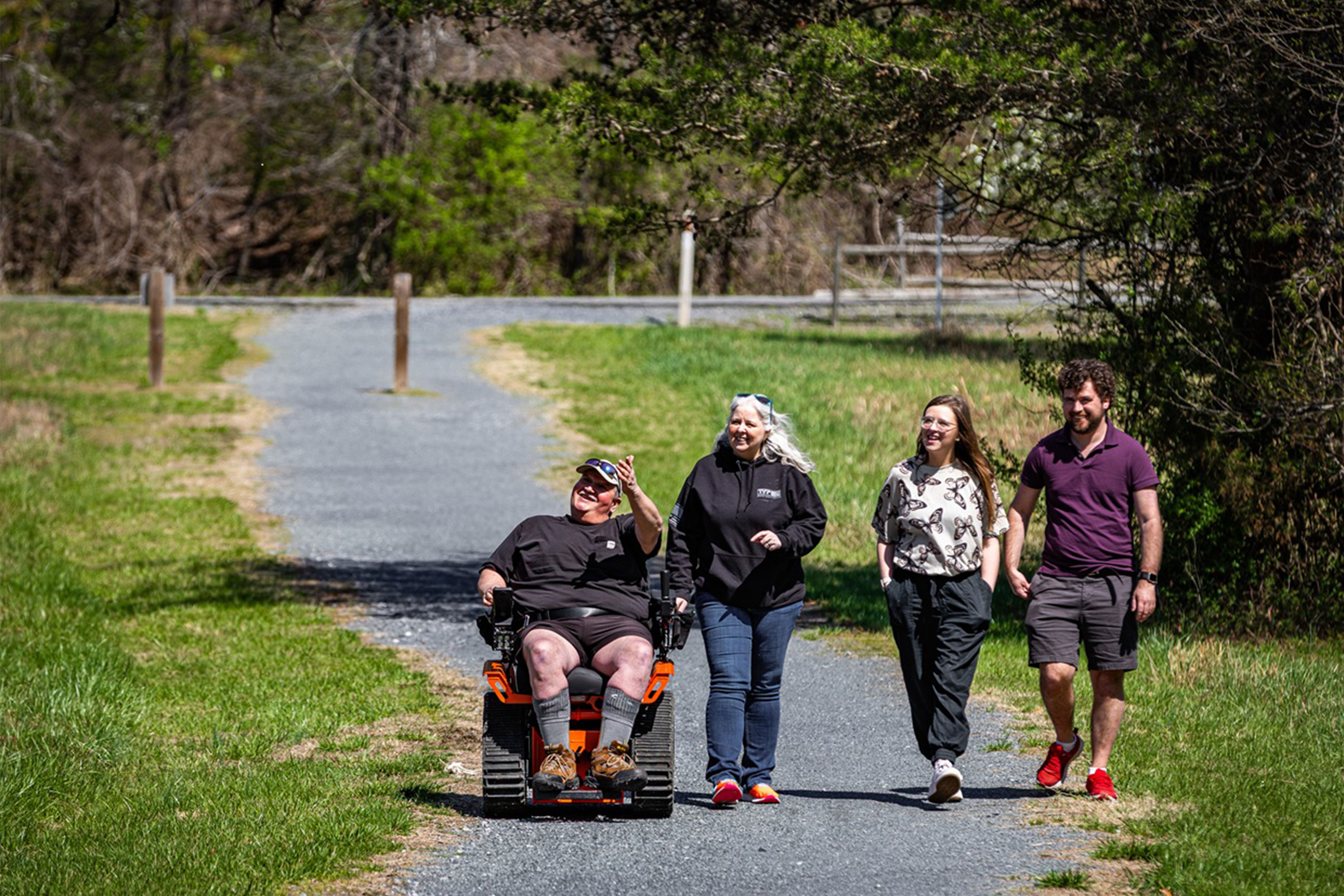 Group of people walking through a park